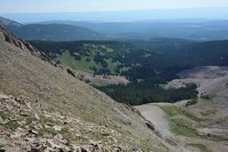 Looking down dark canyon from the saddle, with hikers toiling up the steep slope [fri jul 6 10:33:33 mdt 2018]